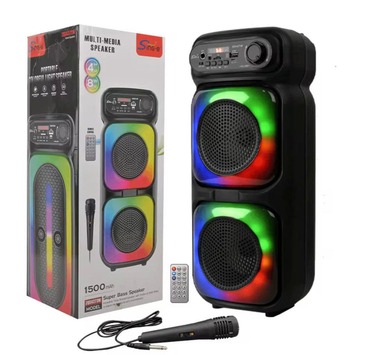 Multimedia speaker with colorful lights next to its packaging on a white background