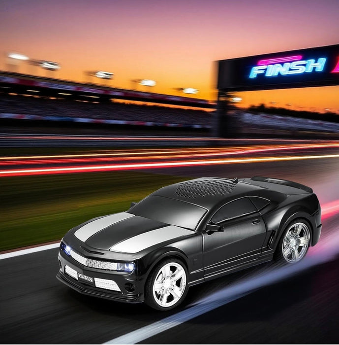 Black sports car on a racetrack with 'FINISH' sign in the background