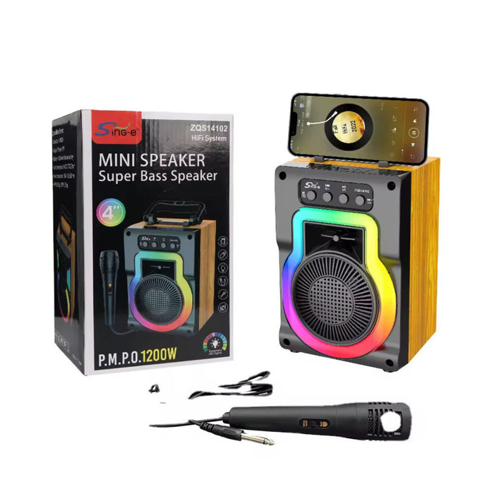 Mini speaker with colorful LED lights, microphone, and packaging on a white background