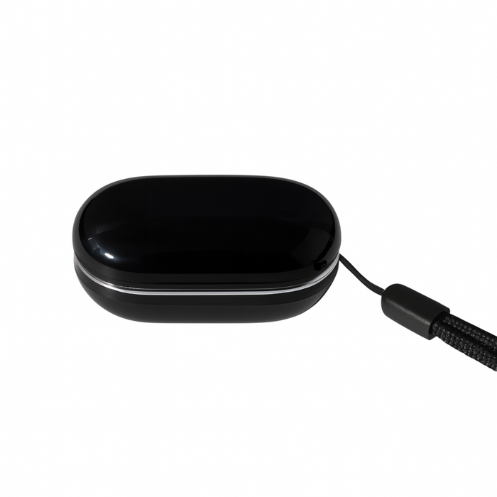 Black rectangular device with a cord on a white background