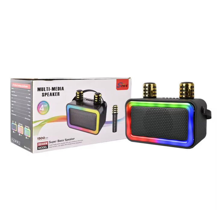 Multimedia speaker with rainbow LED lights next to its packaging on a white background