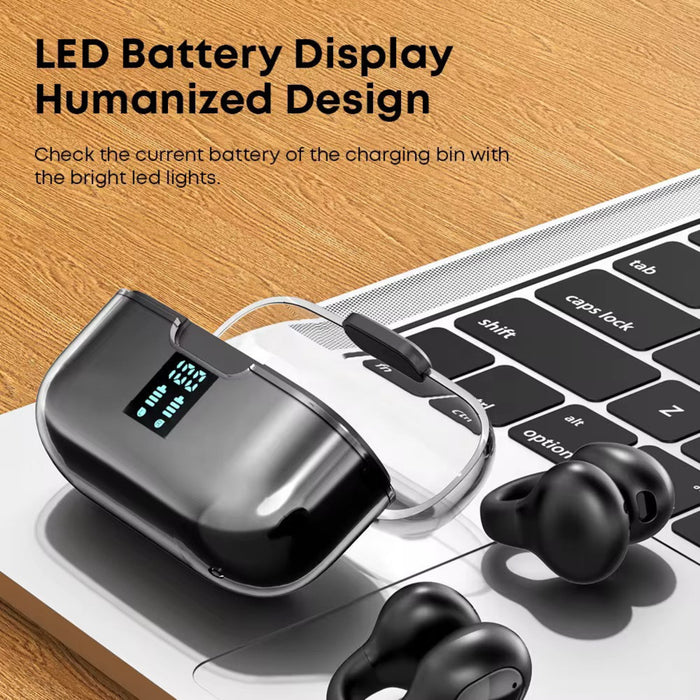 Black wireless earbuds with charging case on a laptop keyboard, featuring LED battery display.