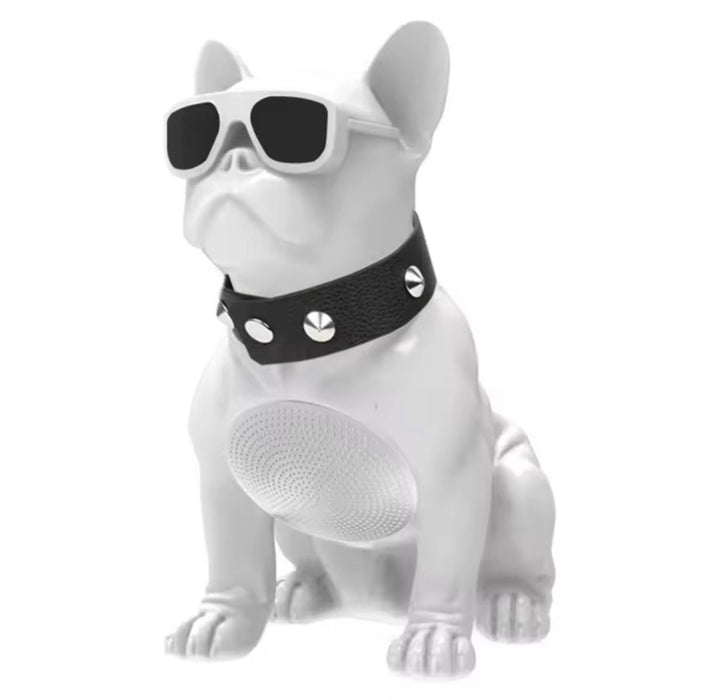 White dog-shaped speaker with sunglasses and a black collar on a white background