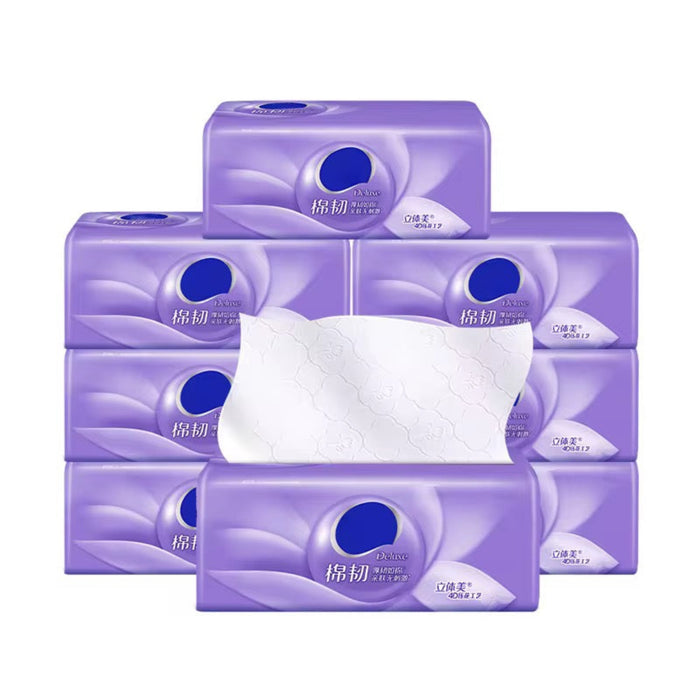 Stack of purple tissue boxes with white tissues on a white background