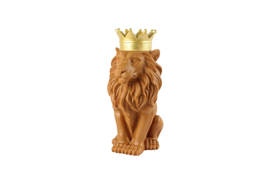 Statue of a lion wearing a gold crown on a white background