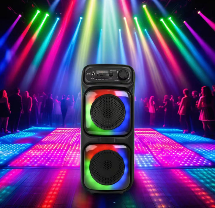 Dj speaker with colorful lights and people in the background