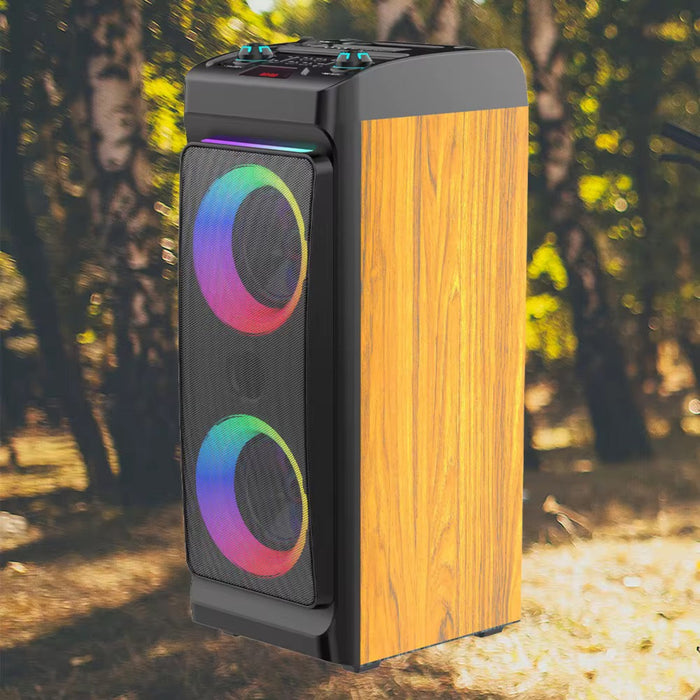 Tall speaker with wooden finish and colorful circular design on a natural background