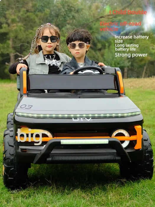Two children in a toy electric off-road vehicle on grass with text about the vehicle's features.