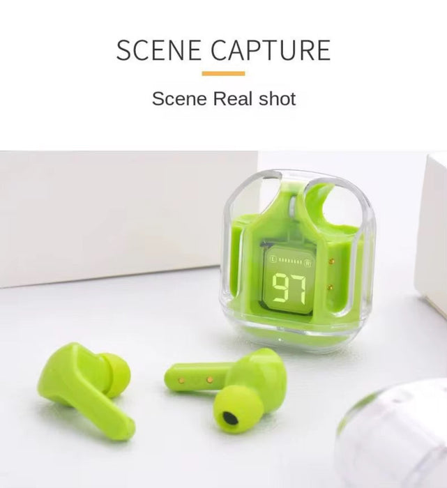 Green wireless earbuds with charging case on a white surface