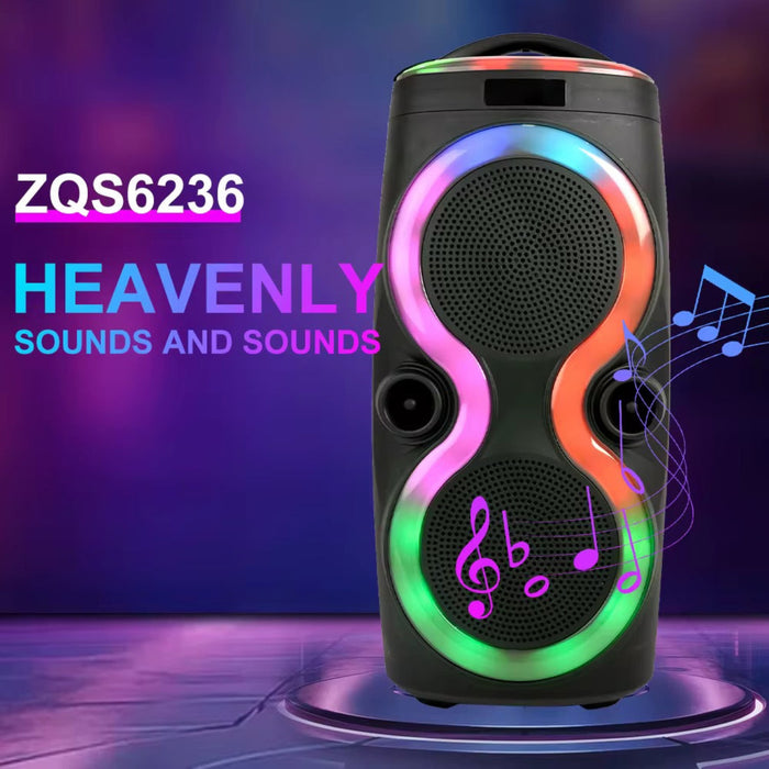 Portable speaker with colorful LED lights on a dark background with text 'ZQS6236 HEAVENLY SOUNDS AND SOUNDS'.