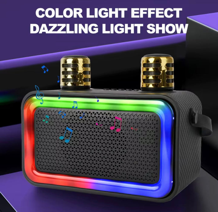Black portable speaker with colorful light effects on a dark background