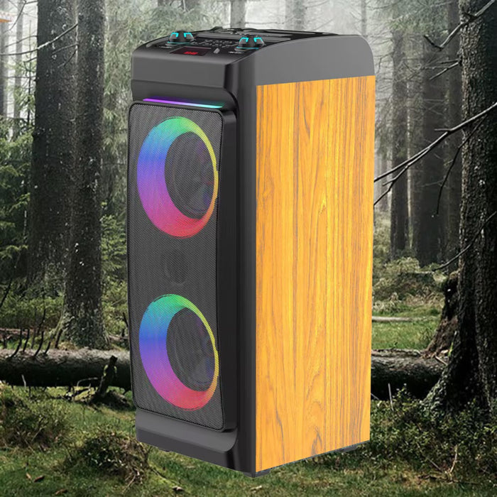 Tall, rectangular speaker with wooden side and colorful circular design in a forest setting