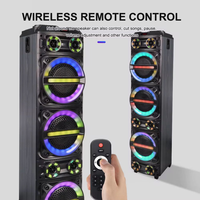 Pair of black speakers with colorful LED lights and a remote control on a light gray background.