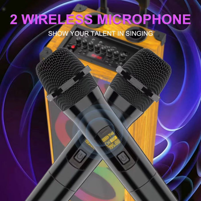 Two wireless microphones in front of a sound mixer with a vibrant purple and blue background.