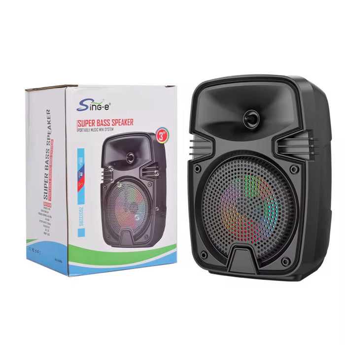 Black portable speaker with colorful LED lights next to its packaging on a white background