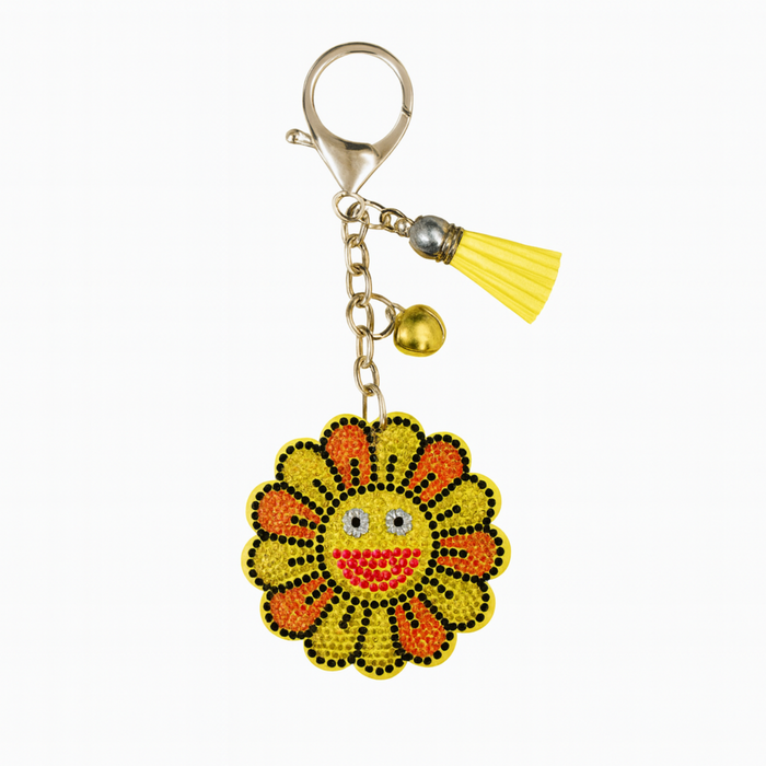 Keychain with a sunflower design and tassel on a white background