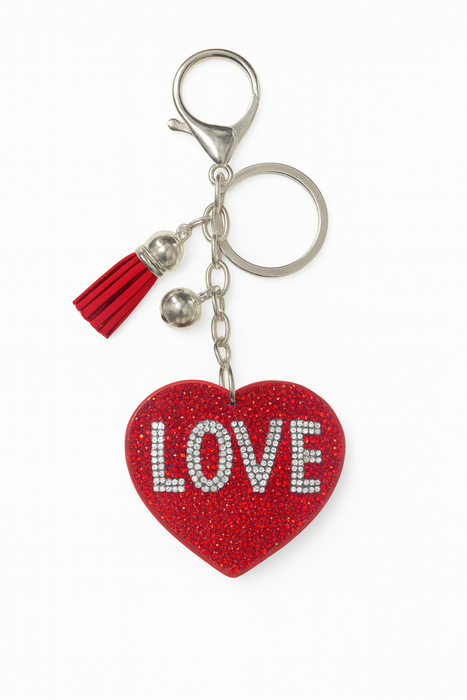 Red heart-shaped keychain with 'LOVE' text on a white background