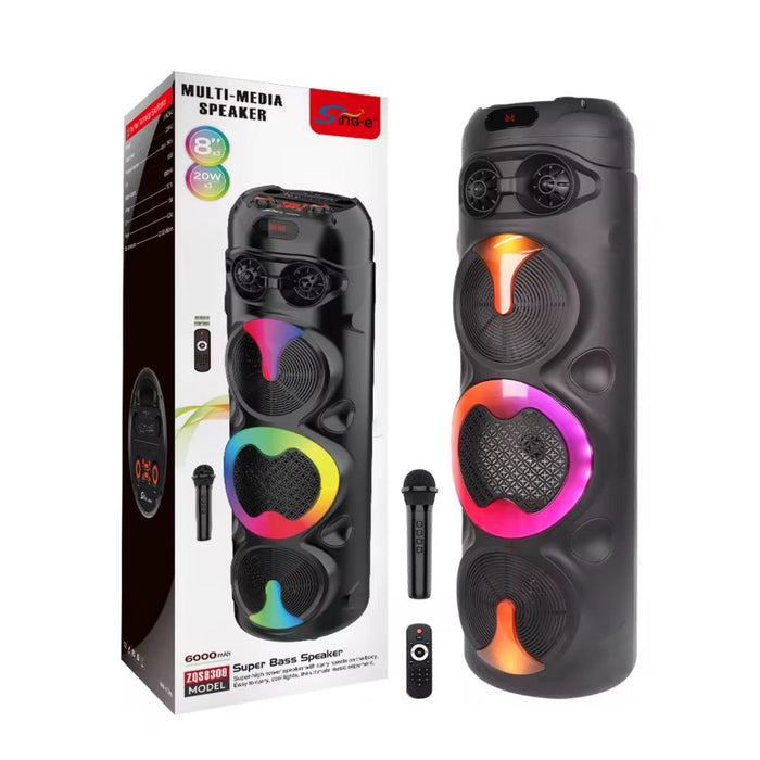 Black multimedia speaker with colorful lights next to its packaging on a white background