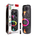 Black multimedia speaker with colorful lights next to its packaging on a white background