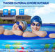 Two children in an inflatable pool with swim caps and goggles, surrounded by a scenic background.