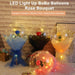 LED light-up BoBo balloons shaped like rose bouquets on a textured wall background.