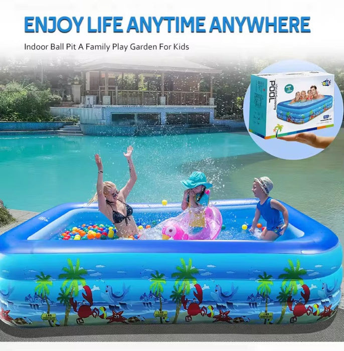 Children playing in an inflatable pool with a scenic design, surrounded by a garden and pool area.