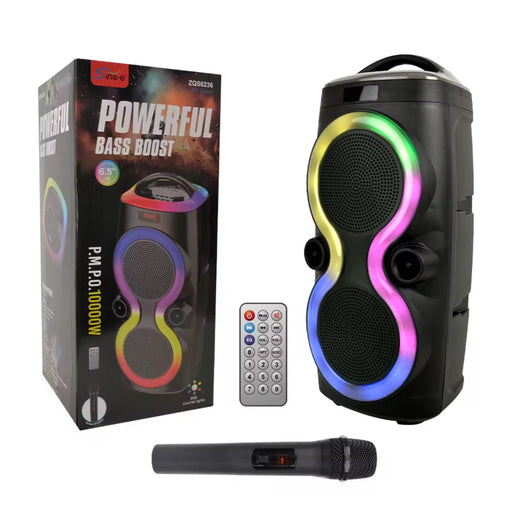 Portable speaker with colorful LED lights, remote control, and microphone on a white background
