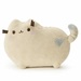 Plush toy resembling a cat with a heart on a white background