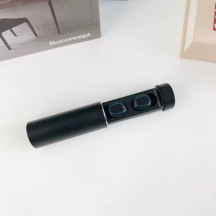Black cylindrical device with circular components on a white surface, Boconcept branding visible.