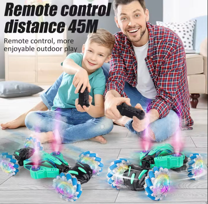 Man and child playing with remote control toys on a wooden floor.