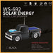 Black toy truck-shaped solar energy music speaker with features listed on a dark background