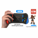 Hand holding a joystick game console with branding and product details on a white background