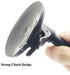 Hand holding a device with a strong chuck design on a white background