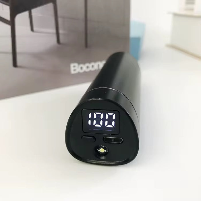 Black electronic device with digital display on a white surface, brand 'Bocon' visible in the background.
