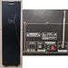 Black electronic device with control panel and antennas on a white background