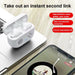 Wireless earbuds in charging case with smartphone displaying music app on wooden surface