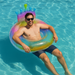 Man floating on a colorful inflatable ring in a pool