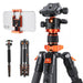 Camera tripod with smartphone holder on a white background